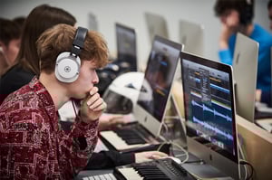 A classroom of students working on their creative projects in Logic Pro X
