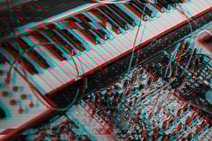 A keyboard and modular rack that have been edited to look like they're visually glitching