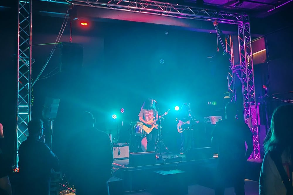 A band performing for the end of year live sound event at Location House
