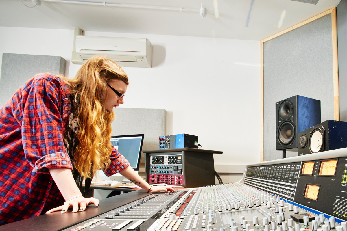 A female student using the SSL AWS924 mixing console-1