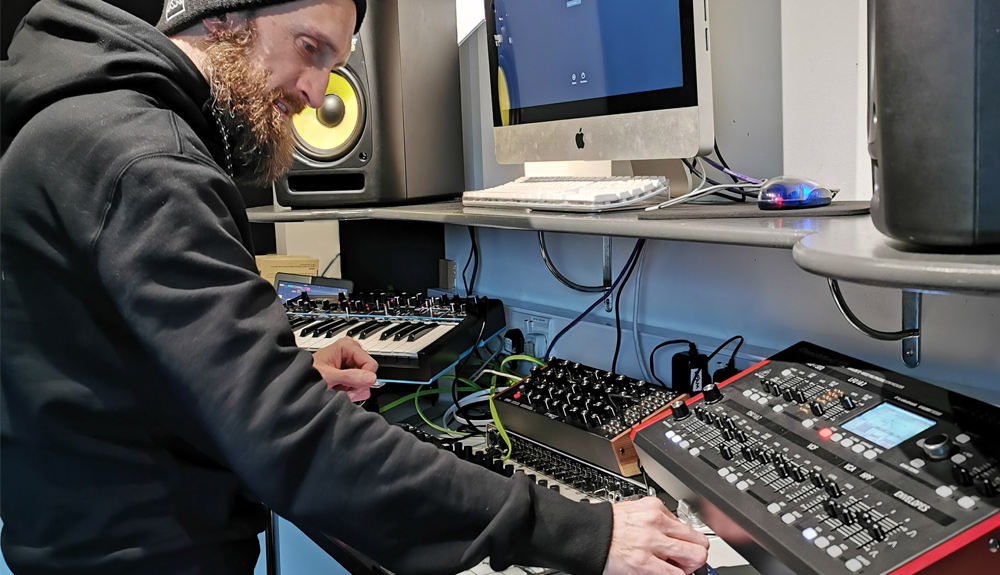 Alex Kearney creating music in the dBs Plymouth DJ production suites