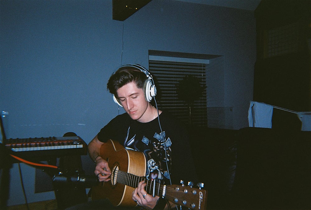 Alex playing guitar