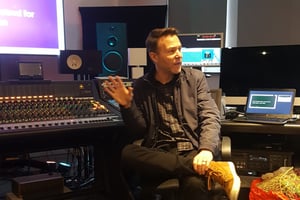 David Cherry sat in front of the Neve Genesys desk in dBs Plymouth during his guest lecture