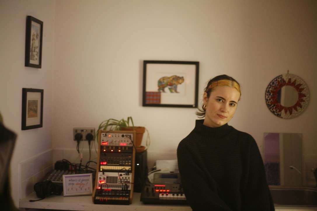 A landscape shot of Bex Ashford in her home studio