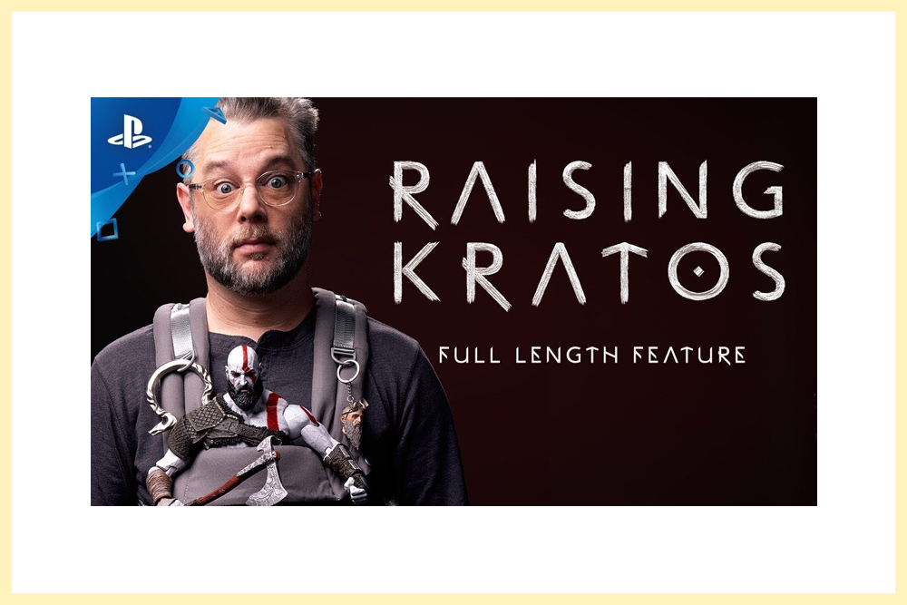 A thumbnail for Raising Kratos: The Making of God of War featuring game director Cory Barlog with a Kratos figure strapped to his chest