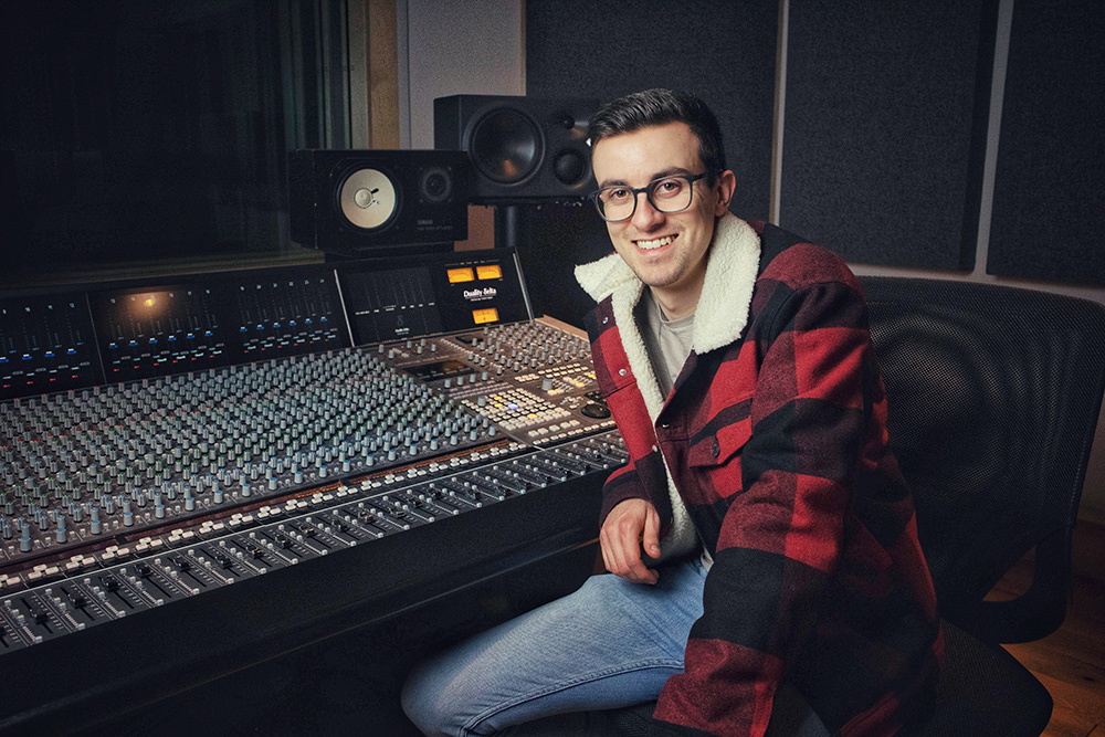 Charlie Griffee (AKA Terrarium) next to an SSL Duality mixing console