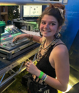 First year student Louise Evans at the mixing desk  on The Northern Embassy stage live at Balter Festival 2022