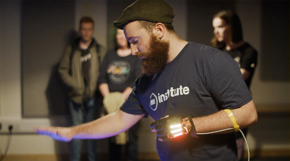 Jacob Zoob performing using his gesture-based MIDI controller at a dBs open day