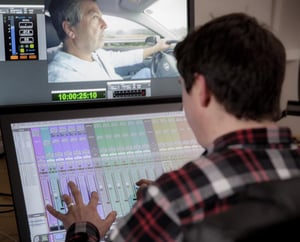 An over the shoulder shot of Tom working on a post-production session in the Denhams Audio studio