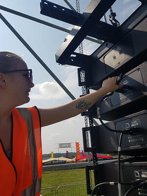 Skye connecting the speaker array at Summer of Love festival