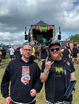 William Taylor-Bennet next to live sound course leader Tom Chitson in front of the Phlegmgasm stage at Balter Festival 2022