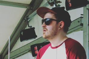 Josh Lyell on stage behind a drum kit
