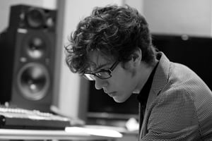 A black and white image of Reilly Smethurst in the recording studio
