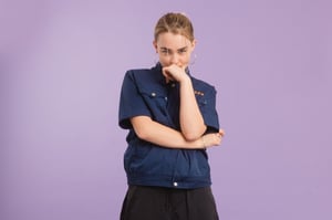 A press photo of Anaïs Jan on a violet background