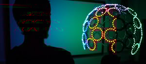A silhouetted man looks on at the Sound Mind art installation