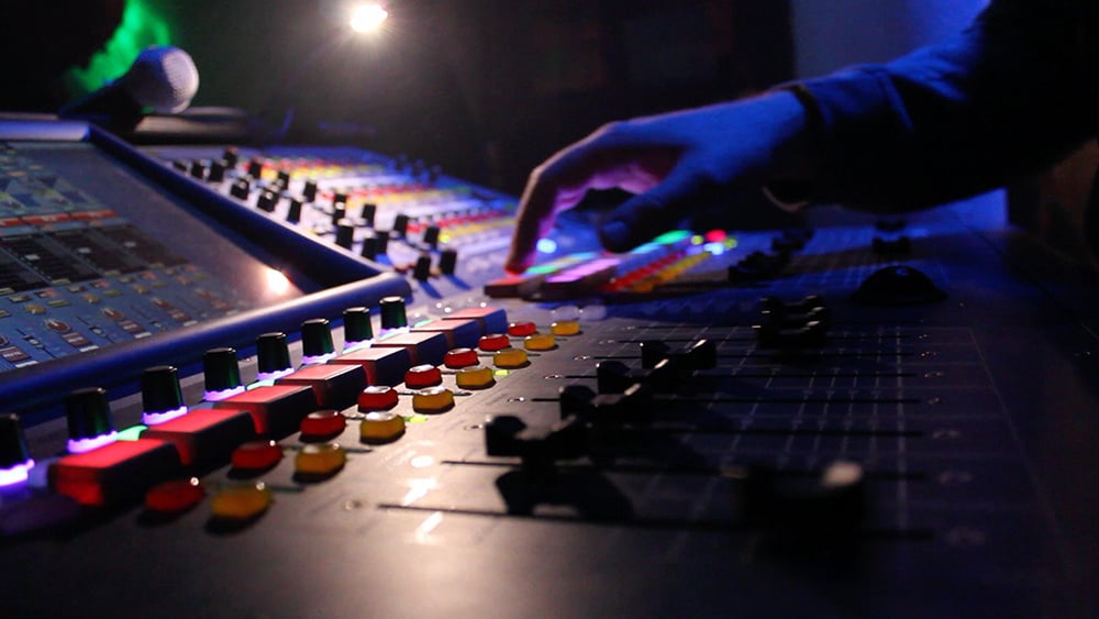 dBs Institute Live Sound student working on a mixing desk