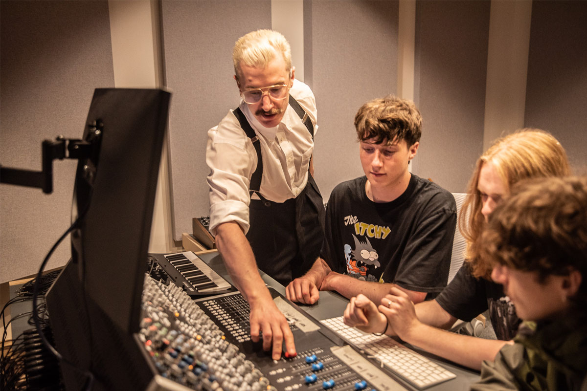 dBs tutor Tim Clerkin walking students through using a mixing desk